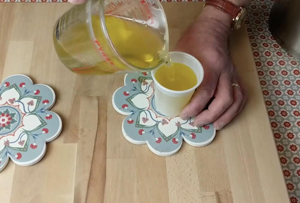 pouring liquid into small containers