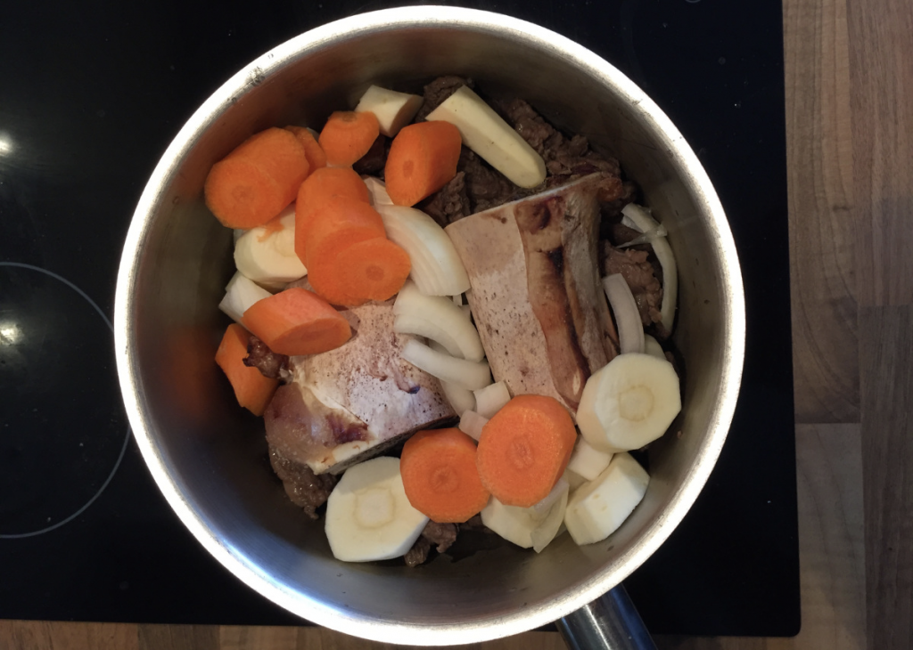 Vegetables added to bones and beef trimmings