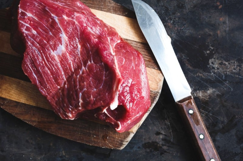 fresh meat and knife with wood chopping board